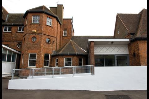 A ramp has been added to the exterior of  the Victorian building to satisfy disability access regulations